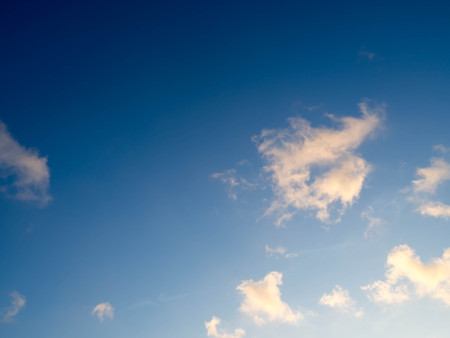 Blue bright sky with white clouds on sunny day. The vast blue sky and clouds sky.Beautiful background. Beautiful blue sky.の写真素材