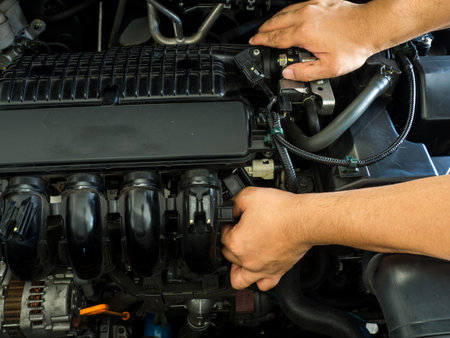 Car mechanic working in auto repair service