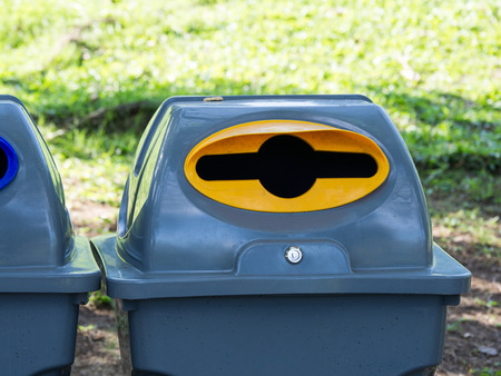 Gray bins for waste sorting are in the public park in bangkok thailand. recycle conceptの写真素材