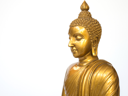 Golden antique buddha statue on the white background (isolated background). The face of the Buddha turned to the right.の写真素材
