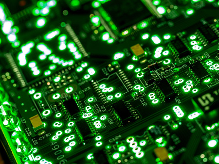 Abstract background,close up green circuit board. Electronic computer hardware technology. Mainboard computer background. Integrated communication processor. Information engineering component.の写真素材