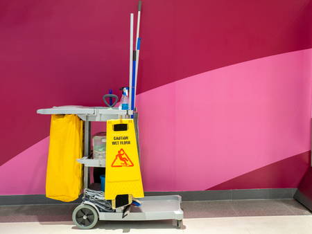 Cleaning tools cart wait for cleaner.Bucket and set of cleaning equipment in the Department store. janitor service janitorial for your place. Concept of service, worker and equipment for cleanerの写真素材