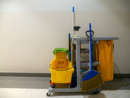 Cleaning tools cart wait for cleaner.Bucket and set of cleaning equipment in the Department store. janitor service janitorial for your place. Concept of service, worker and equipment for cleanerの写真素材