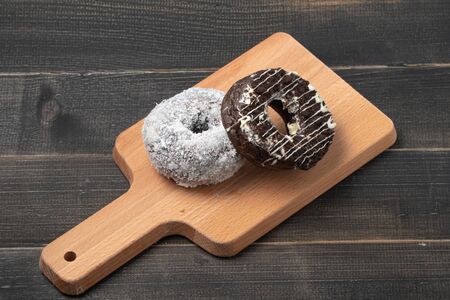 Black chocolate donut And white coconut donutの写真素材