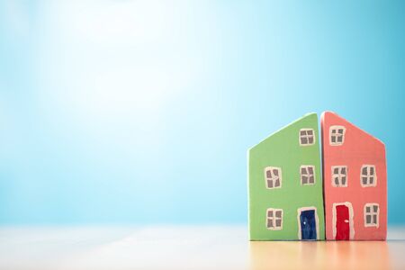 Colorful of the wooden house model on the table and copy space for text. Concept for investment in house building and refinance.の写真素材