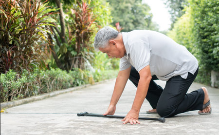 Asian senior man falling down at home in the backyard caused by myasthenia (Muscle Weakness) and the...