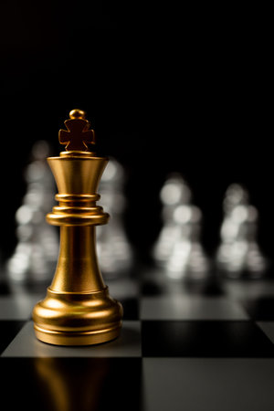 Golden King chess standing in front of other chess, Concept of a leader must have courage and...