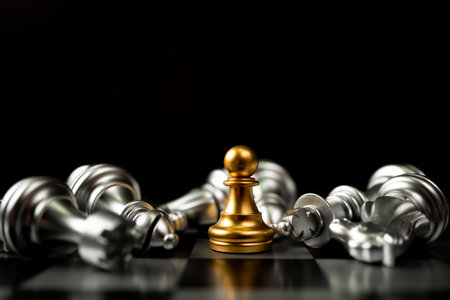 Golden Chess pawn is last standing in the chess board, Concept of successful business leadership, business vision for a win in business gamesの写真素材