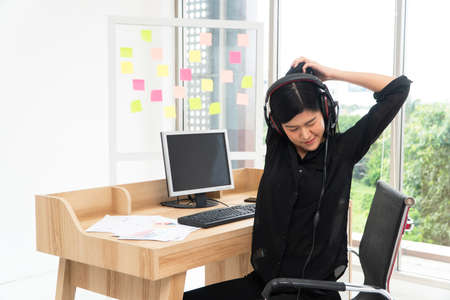 Asian business woman relax after Video Conference for talk to colleagues work from home office,  girl student talking by video conference call, female teacher trainer from home at living roomの写真素材