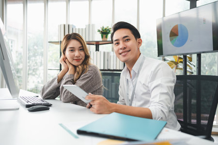 Successful team of new business startup people working together in creative office, happy euphoric proud Asian male and female professional winner feel overjoyedの写真素材