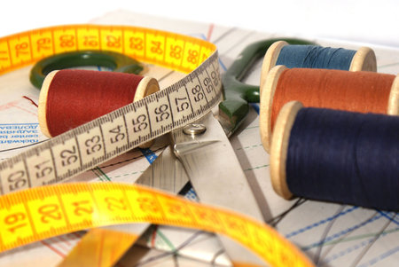 Scissors, sewing patterns and a measuring tape