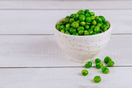 Crispy fried salted green pea in white bowl.の写真素材