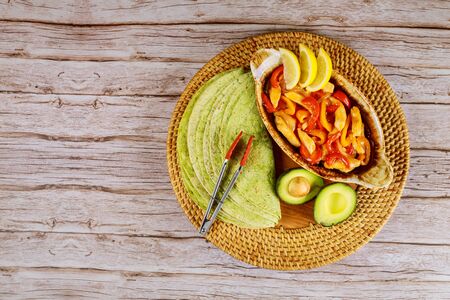 Spinach tortillas with fajita and avocado. Mexican cuisine.の写真素材