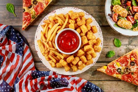 Patriotic party table with delicious food and flag for american holiday.の写真素材