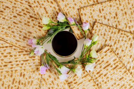Matzah and a silver cup full of wine. Jewish holidays Passover concept.の写真素材