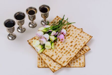 Matzah and four wine cups. Jewish holidays Passover concept.の写真素材