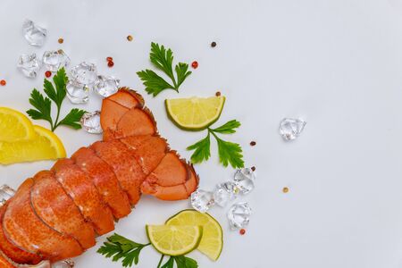 Cooked lobster tails with lemon and parsley. Top view.の写真素材