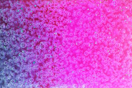 Pink and purple neon background with air bubbles. Slime concept.の写真素材