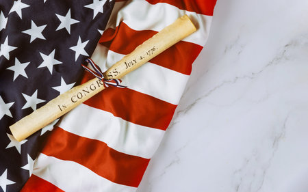 Fourth of July Day. Declaration of Independence parchment roll document with US flag on white...