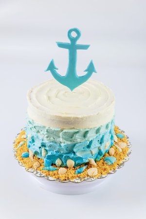 Marine cake decorated with fondant anchor on the top.