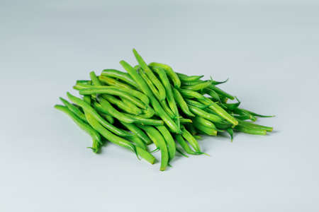 Fresh green long beans isolated on a white background.の写真素材