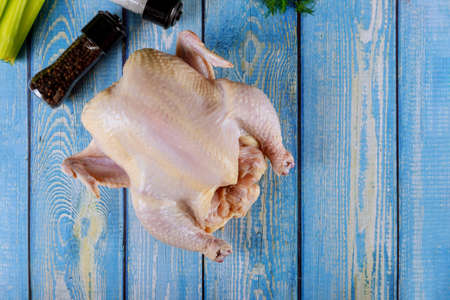 Raw whole chicken with vegetable ready for cooking chicken broth.の写真素材