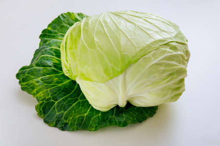 Whole green cabbage isolated on a white background. Produce product.の写真素材