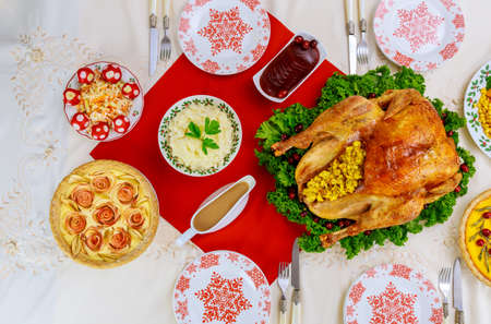 Christmas or New Year dinner with roasted turkey and traditional dishes. Top view.の写真素材