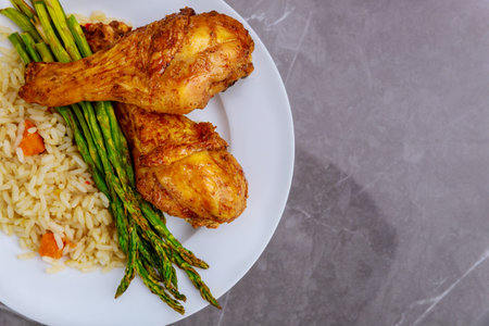 Roasted turkey drumsticks with rice on rustic wooden background. Top view.の写真素材