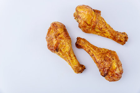 Roasted chicken drumsticks marinated with buffalo sauce isolated on white background. Top view.の写真素材