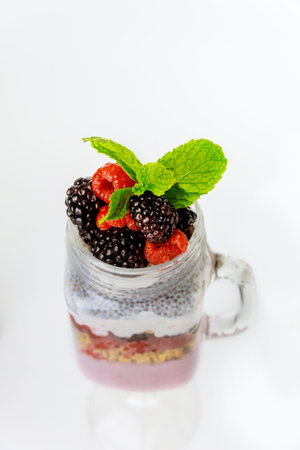 Breakfast dessert with chia pudding, greek yogurt and granola. Healthy food.