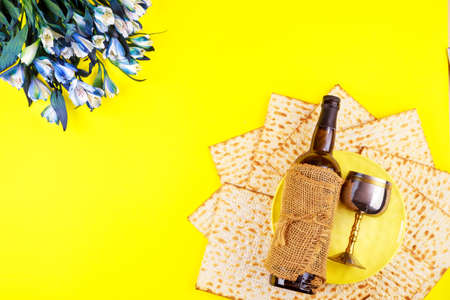 Passover symbols matzoh, red wine and flowers. Jewish holiday.の写真素材