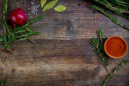 Top view of aromatic dry herbs and spices on rustic wooden table.の写真素材