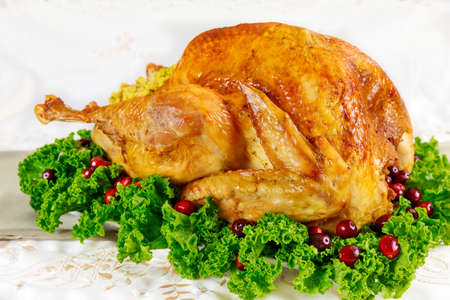 Roasted turkey with cranberries on christmas or thanksgiving table.の写真素材