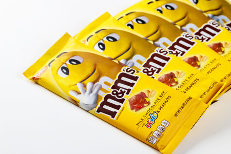 May 4, 2021. New York, US. MMs milk chocolate bars with peanut isolated on white background.