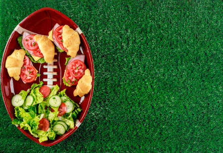 Take out or order fresh meal for fan of football game. American football game concept.の写真素材