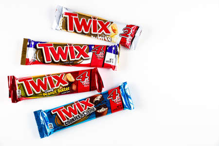 May 4, 2021. New York, US. Variety of Twix cookie bars with creamy caramel on white background.のeditorial素材