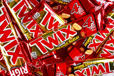 May 4, 2021. New York. Twix cookies coated with milk chocolate isolated on a white background.