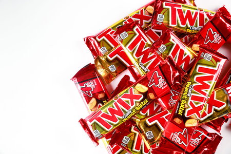 May 4, 2021. New York. Twix cookies coated with milk chocolate isolated on a white background.