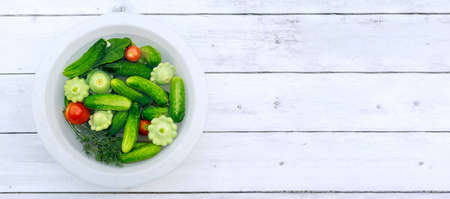 Fresh vegetables picked from the garden are ready for cooking.の写真素材