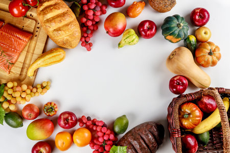 Harvest of fruits and vegetables on table as a background.