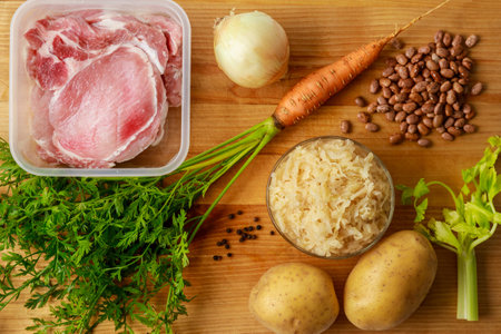 Ingredients on wooden board that go into making sauerkraut soup.の写真素材