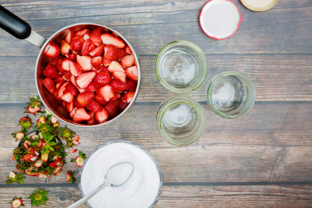 Cleaning and slicing fresh red strawberries for making jamの写真素材