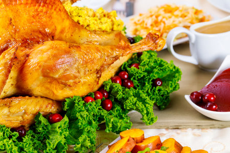 For Thanksgiving, herbs and cranberries are used to decorate the turkey.の写真素材
