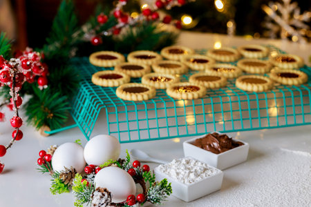 Chocolate filling and ingredients for making tasty Christmas cookies.の写真素材