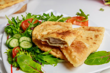 Turkish cuisine is tasty chebureki fried dough with meat.の写真素材