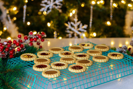 Making tasty christmas cookies with jam and chocolate.の写真素材