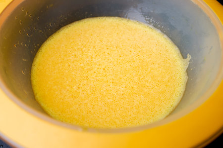 A raw egg omelet is ready after being stirred together.の写真素材