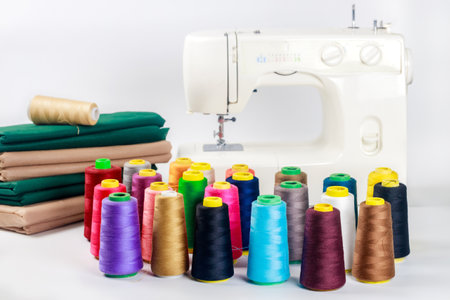 With fabric and thread, a sewing machine is used.の写真素材