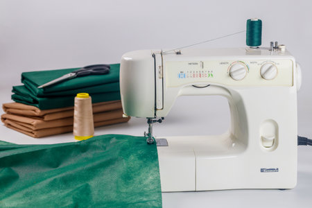 October 30, 2023. Spartanburg, SC USA. Fabric and thread are attached to a sewing machine Kenmore.のeditorial素材